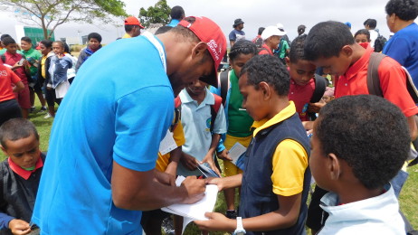 Vdoafone Fiji 7s player Osea Kolinisau signing autographs for Namaka Public School students